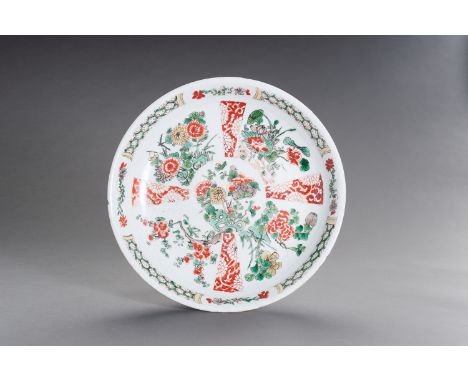 A FAMILLE VERTE ENAMELED PORCELAIN 'FLORAL' CHARGER, KANGXIChina, 1662-1722. The rounded sides rising from a short tapering f