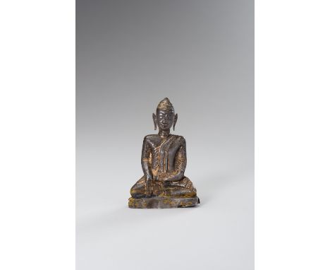 A SILVER REPOUSSE BUDDHA FIGURECambodia, 16-17th century. A silver repousse statue of Buddha with serene facial expression, s