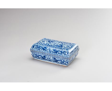 A BLUE AND WHITE 'DRAGON' SCENT BOX AND COVERChina, Qing Dynasty (1644-1912). The rectangular porcelain box decorated in unde