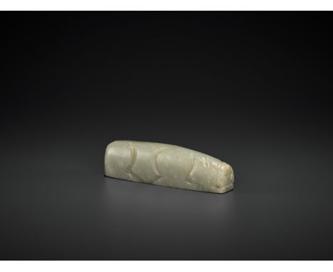 A CELADON JADE PIGJade. China, Han dynasty, 206 BC - 220 ADThe stone is carved as a recumbent pig with a flat snout and point