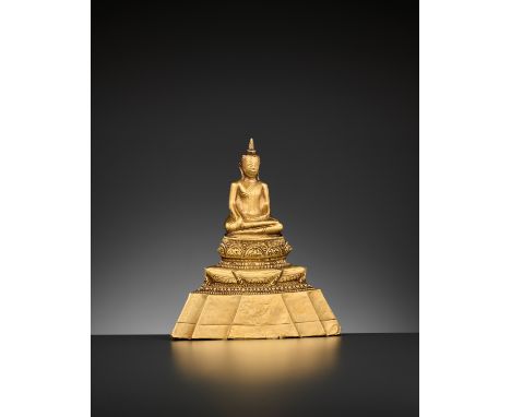 A 24-CARAT GOLD REPOUSSE FIGURE OF BUDDHA SHAKYAMUNI, AYUTTHAYA STYLEThailand, 19th century. Seated in dhyanasana atop a fine