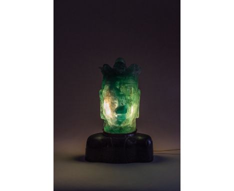 A VERY LARGE GREEN AMETHYST HEAD OF GUANYIN MOUNTED AS A LAMPChina, 1900 to 1920. The transparent stone is of an appealing gr