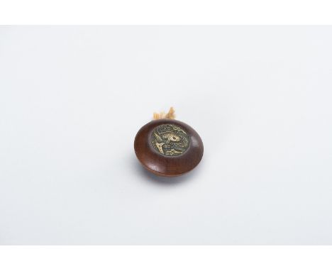 A WOOD KAGAMIBUTA NETSUKE WITH A BRASS LID DEPICTING A CARPJapan, late 19th centuryThe wood bowl inset with a brass plate por