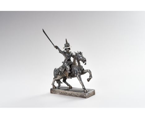 A MASSIVE SILVER FIGURE OF THE LAST BURMESE KING ON HORSEBACKBurma, 1880s. Realistically cast on a rectangular base, depictin