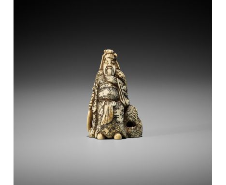 AN IVORY NETSUKE OF KAN'U LEANING AGAINST A ROCKUnsignedJapan, late 18th century, Edo period (1615-1868)The god of war Kan'u 