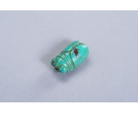 A TURQUOISE MINIATURE PENDANT OF A CICADAChina, presumably Ming Dynasty (1368-1644). The stone of a beautiful blueish hue and