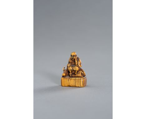 AN EARLY IVORY NETSUKE OF ROSHI AND OXJapan, 18th century, Edo period (1615-1868)The ivory netsuke with a nice honey patina d