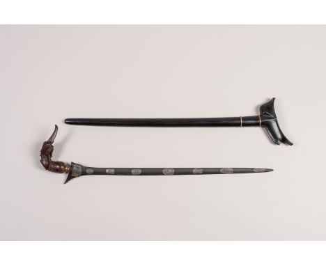 A SLENDER INDONESIAN KRIS, PANJANGIndonesia, Panjang, early 20th century. The slender and straight iron gandar (blade) with i