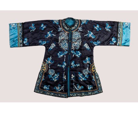 A 'BUTTERFLIES AND LOTUS' LADY'S ROBEChina, 1900 - 1920. Finely worked in Beijing stitch and satin stitch with numerous flutt