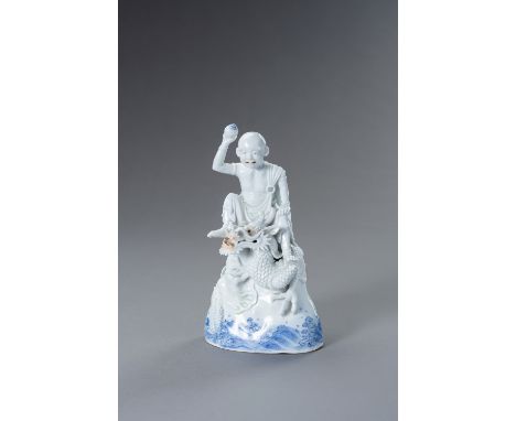 A HIRADO PORCELAIN FIGURE OF RAKAN HANDAKA SONJA WITH DRAGONJapan, 19th centuryThe fine blue and white glazed figure, depicti
