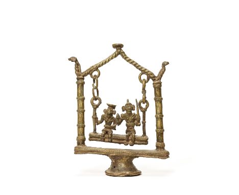 A BASTAR BRONZE OF GODDESSES ON A SWINGIndia, 19th-20th century. Swings are among the strangest but at the same time the most