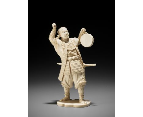 TOSHIMICHI: A FINE IVORY OKIMONO OF A SAMURAI WITH DRUMBy Toshimichi, signed ToshimichiJapan, Meiji period (1868-1912)Finely 