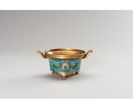 A SOLID CLOISONNE ENAMEL TRIPOD INCENSE BURNERChina, Qing Dynasty (1644-1912). The cylindrical gilt-copper body, sturdily cas