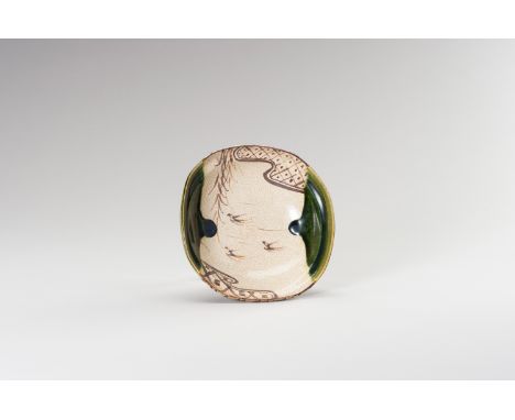 A FINE ORIBE CERAMIC BOWLJapan, Meiji period (1868-1912)The oribe ceramic bowl of rounded square shape. The bowl shows two sy