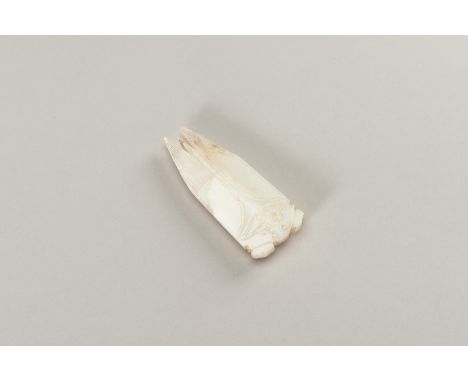 A HAN-STYLE ARCHAISTIC WHITE JADE OF A CICADAChina, Han Dynasty style, but later. Finely carved as a cicada with folded veiny