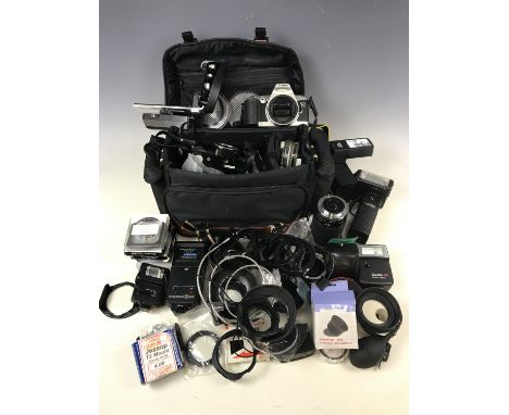 A Canon EOS500 camera body together with a large quantity of filters, a Sunpak MX134 flashgun and others, a Vivitar 28-210mm 