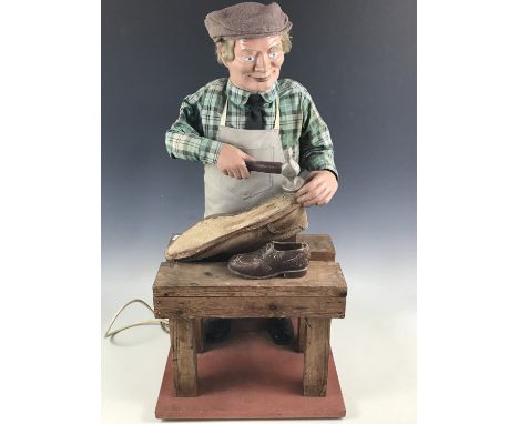 A 1960s cobbler's shop window automaton advertising figure, 80 cm