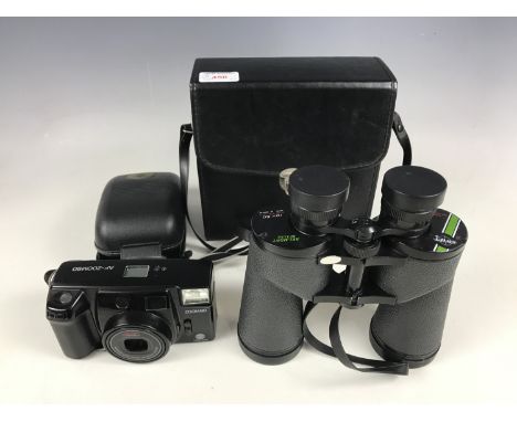 A Minolta AF-Zoom90 camera and a set of Swift Belmont De Luxe 10 x 50 binoculars