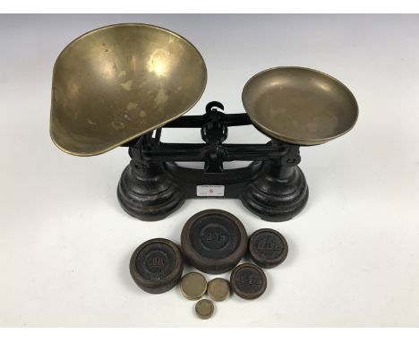 A vintage set of kitchen scales and weights