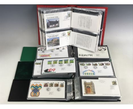Three Stanley Gibbon cover albums containing a quantity of GB First Day Covers, circa 1990-2000, together with one further al