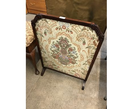 A floral embroidered fire screen