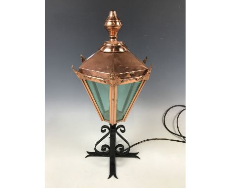 A cast metal and copper table lamp in the form of a lantern 