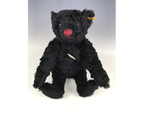 A Steiff Titanic 1912 replica Classic growling bear, with black mohair and red felt rimmed eyes, 44 cm