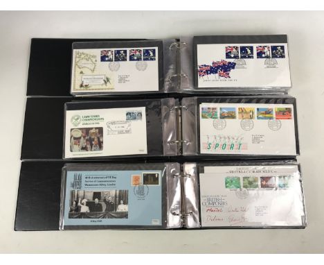 Three Stanley Gibbon cover albums containing a quantity of GB First Day Covers, circa 1984-1989, including a signed 25th Anni