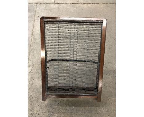 An early 20th Century wooden framed bed rest, with maker's plaque