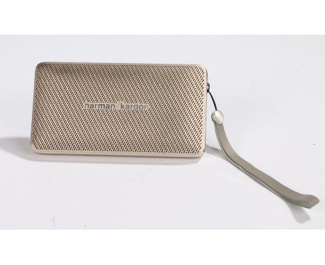 Ed Sheeran's Harman Kardon portable Bluetooth speaker, the silver body with easel back and wrist strap, 14cm wide 7.5cm high.