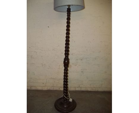 A BARLEY TWIST ANTIQUE FLOOR STANDING STANDARD LAMP