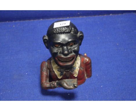 A VINTAGE CAST IRON MONEY BOX