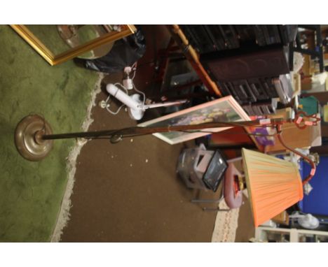 A METAL STANDARD LAMP WITH SHADE 