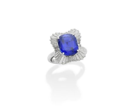 A SAPPHIRE AND DIAMOND RINGThe cushion-shaped sapphire, weighing 7.87 carats, within an undulating surround of baguette and t