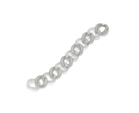 A ROCK CRYSTAL AND DIAMOND BRACELET, BY SEAMAN SCHEPPSComposed of alternating pavé-set brilliant-cut diamond and carved rock 