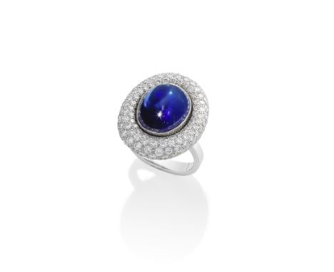 A SAPPHIRE AND DIAMOND RING, BY GRIMA, 1993The oval cabochon sapphire weighing 18.81 carats, within a bombé surround, pavé-se