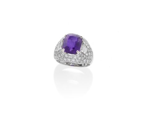 AN AMETHYST AND DIAMOND 'TROMBINO' RING, BY BULGARI, MID-20TH CENTURYThe cushion-shaped amethyst in a bombé mount, pavé-set w