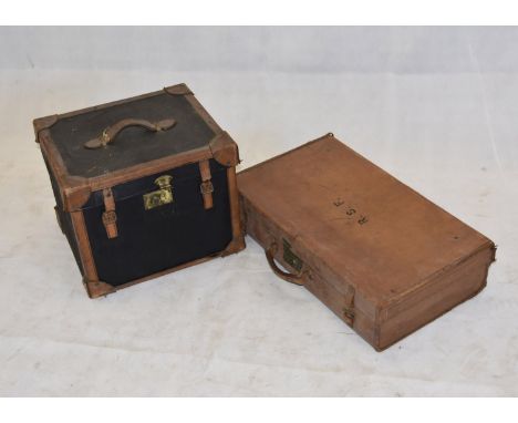 An Edwardian canvas and leather bound travelling trunk, with brass fittings, 45 cm x 39 cm x 36 cm high together with an army