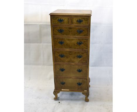 A reproduction burr walnut veneered tallboy, of two short drawers over five graduating drawers on bracket cabriole supports, 