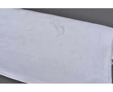 An early 20th Century damask cotton tablecloth, the overall design depicting sea life surrounded by a shell border with engra