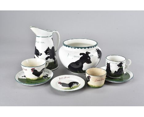 A collection of The Bristol Cat and Dog ceramics, with designs after Louis Wain comprising a milk jug, inscribed 'Oh Chase Me