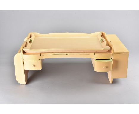A mid 20th Century painted wooden breakfast tray, with lift off top, raised pedestal ends for post and newspapers with hinged