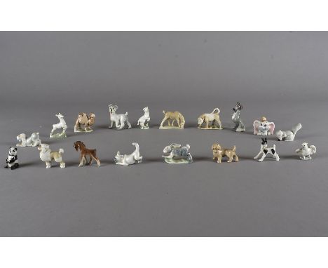 A collection of eighteen Wade and other miniature figures, including rabbits, squirrels, bull and Disney figures (18)Most fig