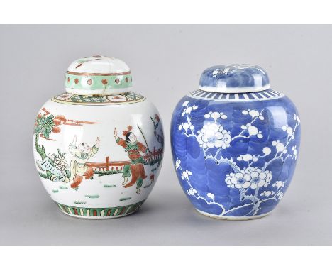 Two late 19th/early 20th Century Oriental ginger jars and covers, one in blue and white, similar to willow pattern, the other