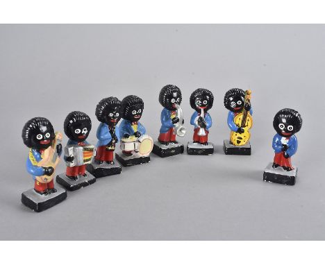 A eight piece Golly Band figure set, comprising drums, saxophone, singer, trumpet, bass, guitar, clarinet and accordion (8) 