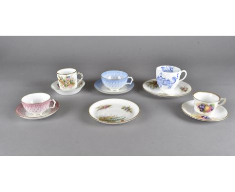 A small collection of cups and saucers, including a Staffordshire botanical painted trio, a Royal Worcester transfer printed 