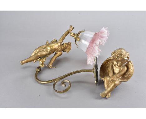 A gilt painted cherub wall light, having flared glass lamp shade, together with a gilt painted figure of a seated cherub, AF 