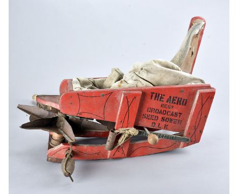 The Aero Broadcast Seed Sower, the vintage handheld piece of equipment, in red, with mechanical mechanism to the front, AF 