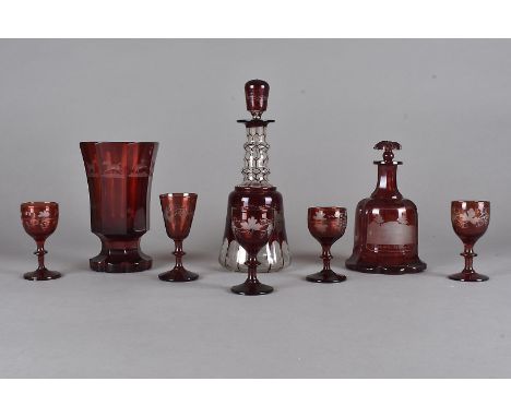 A 19th Century Bohemian cranberry glass faceted footed vase, with engraved design of horses, 17 cm high together with a 19th 