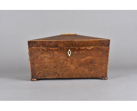 A Regency sarcophagus shaped burr walnut tea caddy, with bone escutcheon, gilt lion mask handles, satin strung, bun feet, 32 